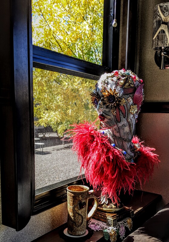 Mug sharing a window with Jo's elegant sculpture creation